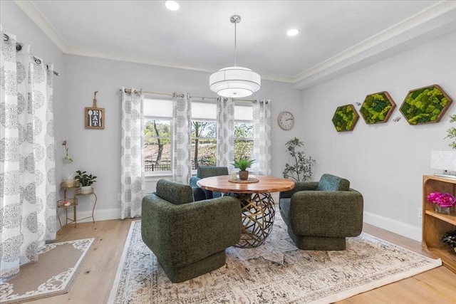 sitting room with crown molding, recessed lighting, baseboards, and wood finished floors