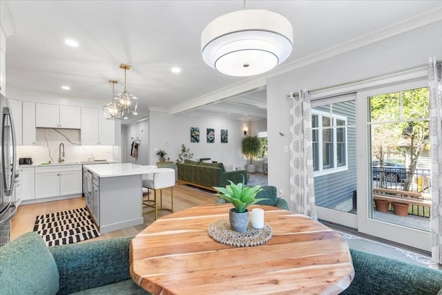 68 Evergreen Unit B, Newton, MA 02466 - dining space with recessed lighting, ornamental molding, and light wood-type flooring