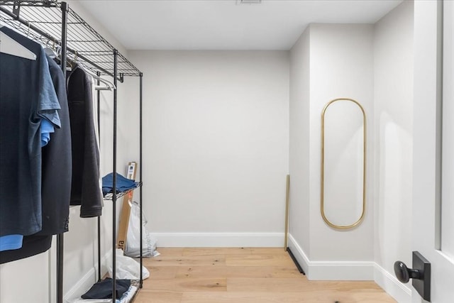 spacious closet with wood finished floors