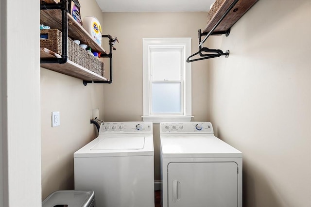 clothes washing area with washer and dryer