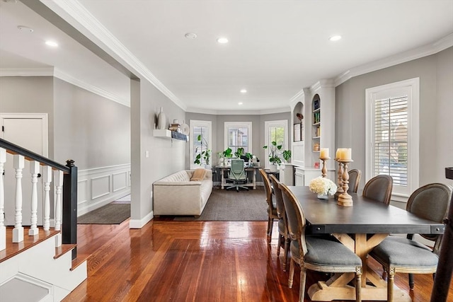 dining room with dark wood-style flooring, recessed lighting, crown molding, and stairway