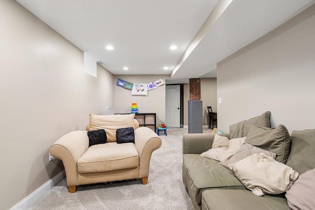 carpeted living area with baseboards and recessed lighting