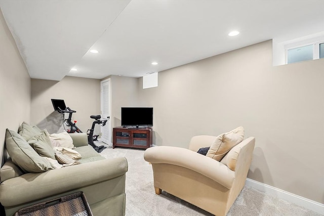 living area featuring recessed lighting, baseboards, and light colored carpet
