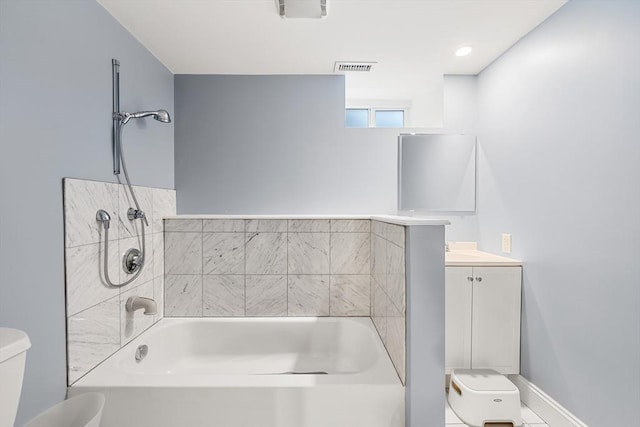 bathroom featuring toilet and vanity