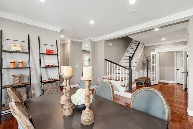 dining space featuring wood finished floors, recessed lighting, stairway, ornamental molding, and baseboards