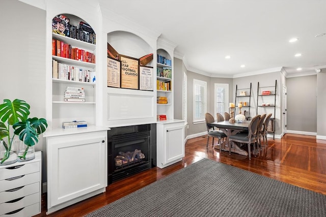 dining space with dark wood-style floors, ornamental molding, recessed lighting, baseboards, and a fireplace