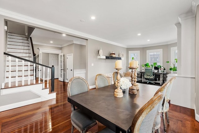 dining area featuring wood finished floors, stairway, recessed lighting, baseboards, and crown molding