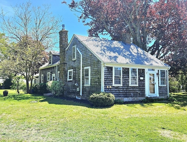 4 Randall Rd, Mattapoisett, MA 02739 - view of property exterior with a lawn, a chimney, and a shingled roof