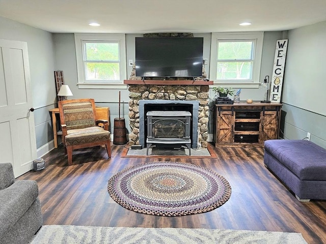 4 Randall Rd, Mattapoisett, MA 02739 - living area featuring wood finished floors, a wood stove, and plenty of natural light