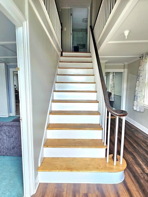 4 Randall Rd, Mattapoisett, MA 02739 - stairway with wood finished floors, baseboards, and crown molding