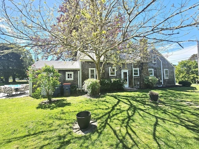 4 Randall Rd, Mattapoisett, MA 02739 - view of front facade featuring a front lawn and a patio