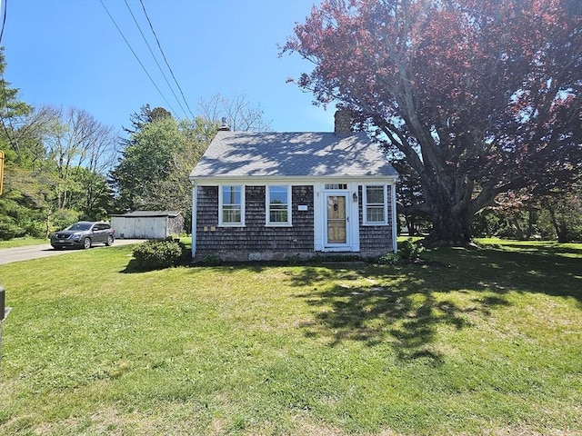 4 Randall Rd, Mattapoisett, MA 02739 - view of front of property featuring a chimney, a front yard, and a shingled roof