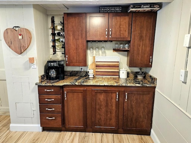 4 Randall Rd, Mattapoisett, MA 02739 - kitchen featuring light wood-type flooring, stone countertops, and baseboards