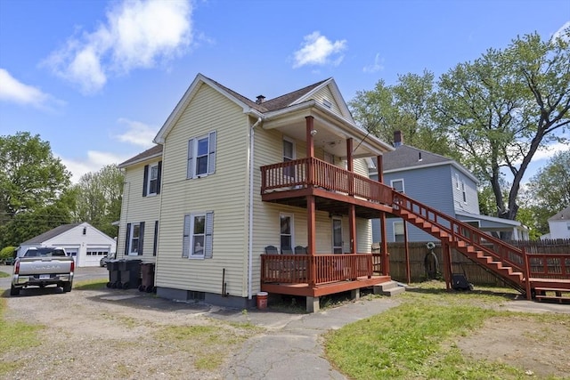 17 Westminster, Westfield, MA 01085 - rear view of house featuring a garage and a deck