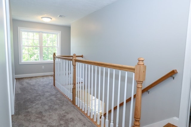 hall with carpet floors