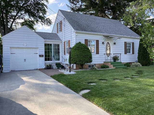 view of front of home with a shingled roof, a garage, driveway, and a front lawn