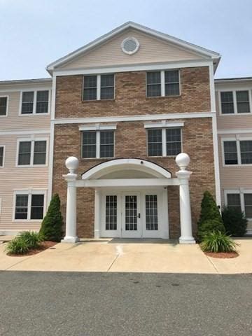 1 Millbrook Ln Unit 201, Wakefield, MA 01880 - view of front of property with french doors and brick siding