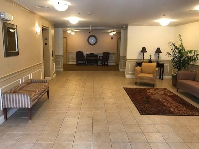1 Millbrook Ln Unit 201, Wakefield, MA 01880 - community lobby with a decorative wall, wainscoting, and ornamental molding