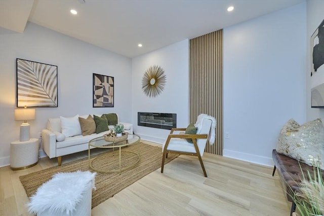 18 Belknap St Unit 2, Arlington, MA 02474 - living area featuring recessed lighting, wood finished floors, and a glass covered fireplace