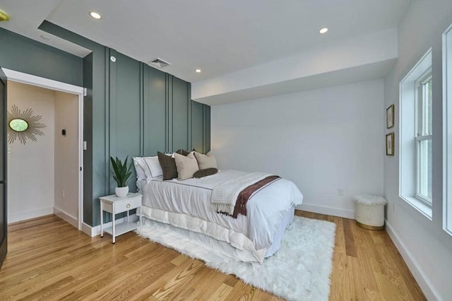 18 Belknap St Unit 2, Arlington, MA 02474 - bedroom with light wood-type flooring and recessed lighting