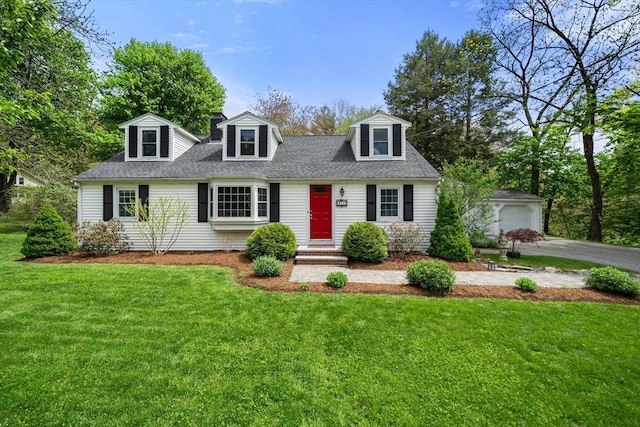 271 Haverhill St, North Reading, MA 01864 - cape cod-style house featuring roof with shingles, a front lawn, an outdoor structure, and a garage
