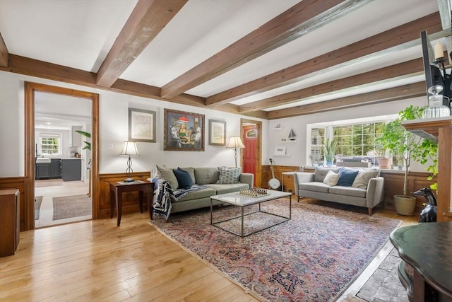 271 Haverhill St, North Reading, MA 01864 - living room with beam ceiling, a wainscoted wall, and light wood-style floors