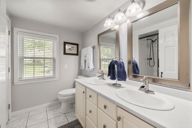 271 Haverhill St, North Reading, MA 01864 - full bath featuring baseboards, double vanity, toilet, tile patterned flooring, and a shower