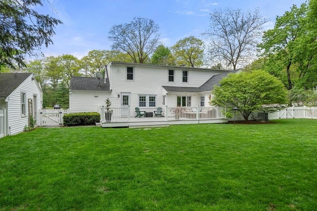 271 Haverhill St, North Reading, MA 01864 - rear view of house featuring a gate, a deck, and roof with shingles