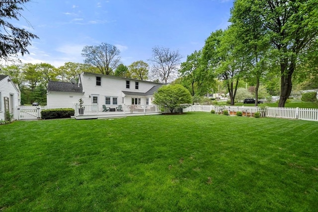 271 Haverhill St, North Reading, MA 01864 - back of property with a wooden deck and a gate