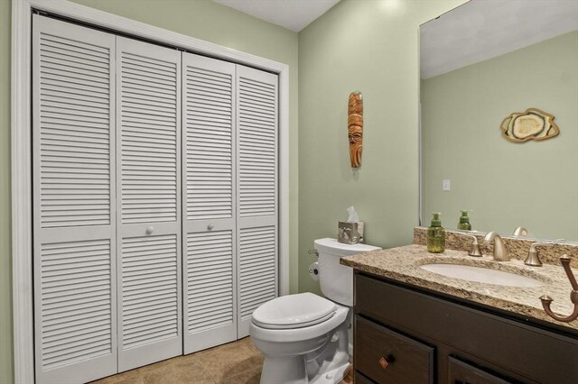 15 Whitewood Cir, Amesbury, MA 01913 - bathroom with a closet, toilet, vanity, and tile patterned floors