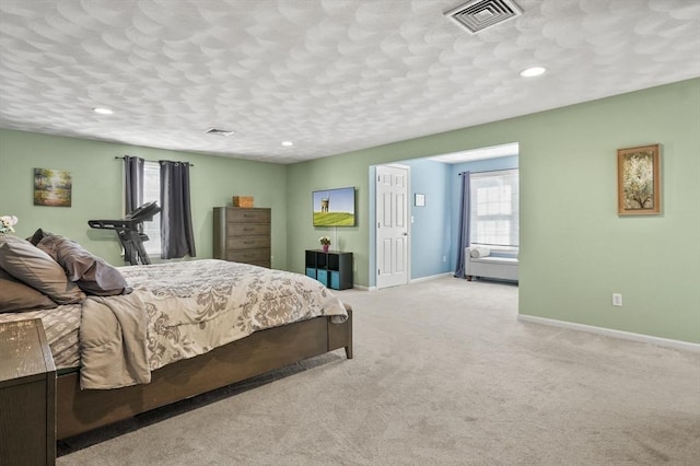 15 Whitewood Cir, Amesbury, MA 01913 - bedroom featuring baseboards, multiple windows, visible vents, and light carpet
