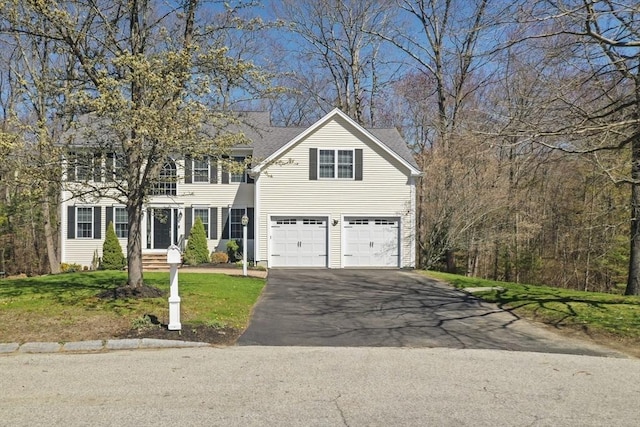 15 Whitewood Cir, Amesbury, MA 01913 - colonial house featuring an attached garage, driveway, and a front lawn