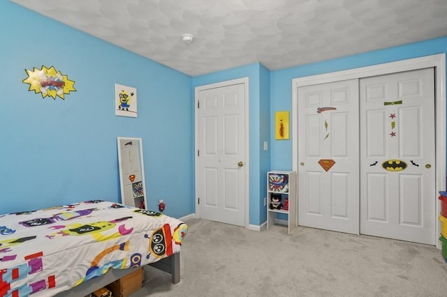 15 Whitewood Cir, Amesbury, MA 01913 - bedroom with light colored carpet, baseboards, and a closet