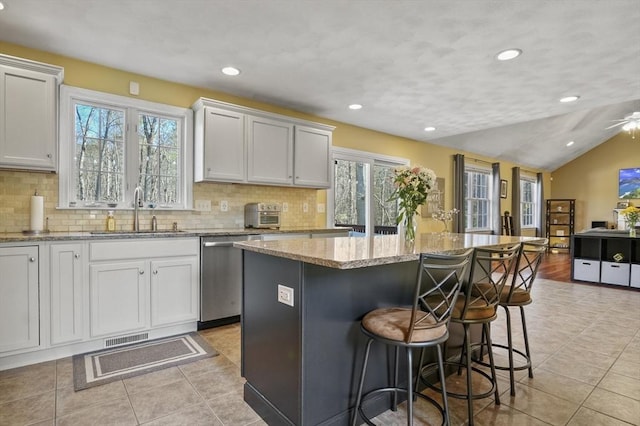 15 Whitewood Cir, Amesbury, MA 01913 - kitchen featuring stainless steel dishwasher, visible vents, a sink, and light tile patterned floors