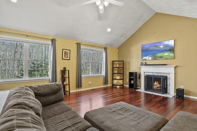 15 Whitewood Cir, Amesbury, MA 01913 - living room with a premium fireplace, vaulted ceiling, wood finished floors, and ceiling fan