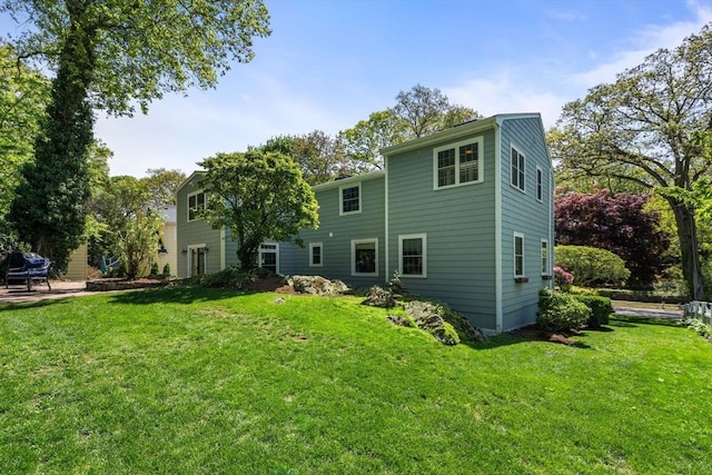 back of house with a yard