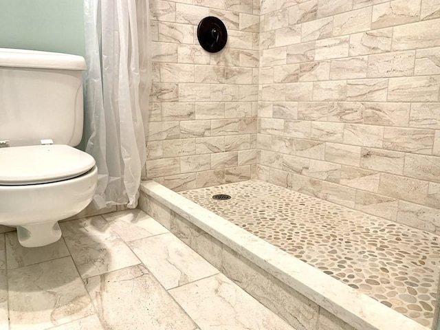 350 Revere Beach Blvd Unit 4P, Revere, MA 02151 - bathroom with toilet, a tile shower, and marble finish flooring
