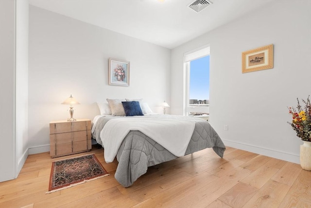 bedroom with light hardwood / wood-style flooring