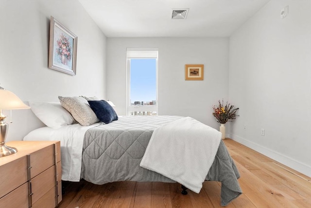 bedroom featuring wood-type flooring