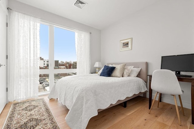 bedroom with light hardwood / wood-style floors