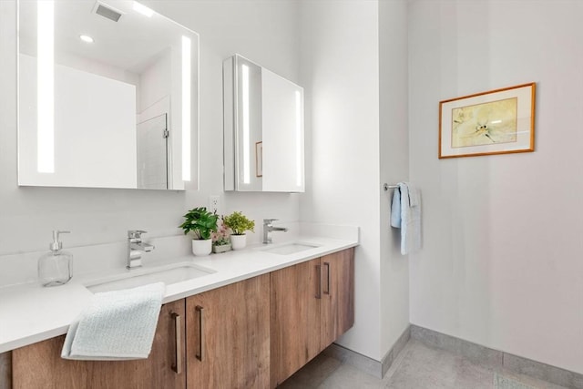 bathroom with vanity and tile patterned floors