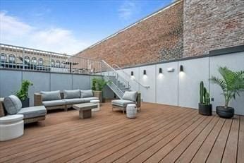 wooden deck featuring an outdoor hangout area