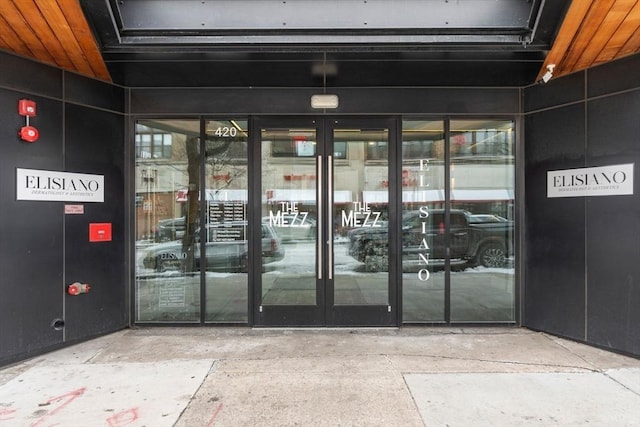 property entrance featuring french doors