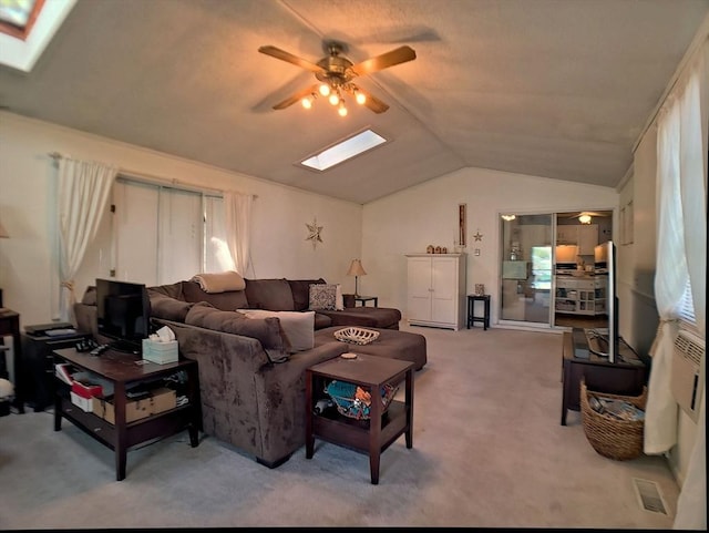 6 Cleveland Ave, Westfield, MA 01085 - carpeted living room featuring visible vents, ceiling fan, and vaulted ceiling with skylight