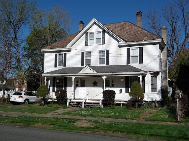 6 Cleveland Ave, Westfield, MA 01085 - country-style home with a porch, a front lawn, and a chimney