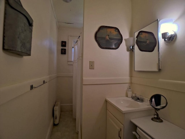 6 Cleveland Ave, Westfield, MA 01085 - bathroom featuring radiator heating unit, tile patterned flooring, and vanity
