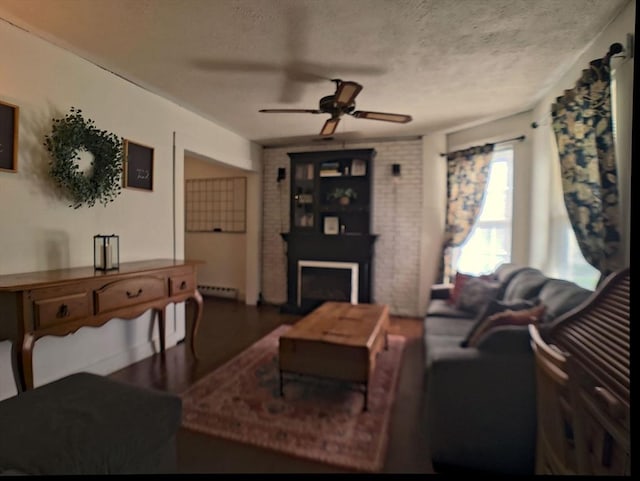 6 Cleveland Ave, Westfield, MA 01085 - living area with a textured ceiling, ceiling fan, a fireplace, and wood finished floors