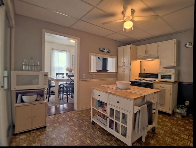 6 Cleveland Ave, Westfield, MA 01085 - kitchen featuring white appliances, a paneled ceiling, white cabinetry, under cabinet range hood, and a ceiling fan