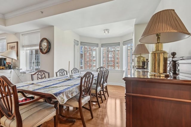 20 Chapel St Unit B811, Brookline, MA 02446 - dining space featuring wood finished floors, baseboards, and ornamental molding