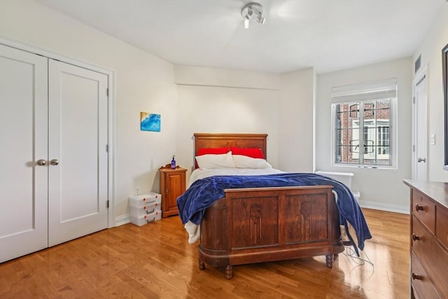 20 Chapel St Unit B811, Brookline, MA 02446 - bedroom with light wood-style floors and baseboards